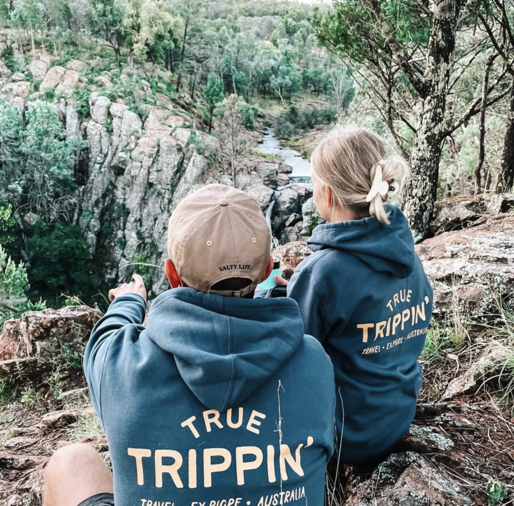 Supporters outdoors in matching printed hoodies
