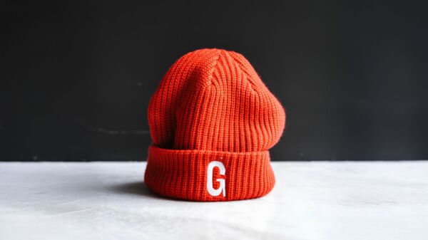 Red beanie with an embroidered cafe logo