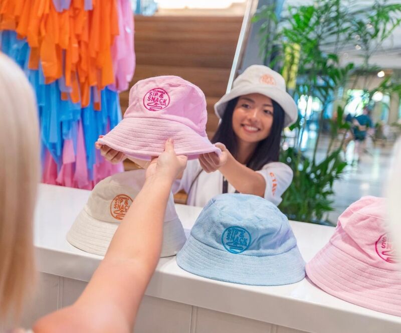 Community group in matching printed bucket hats