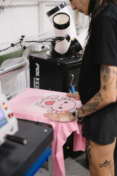 Pressing a printed transfer onto a pink tee